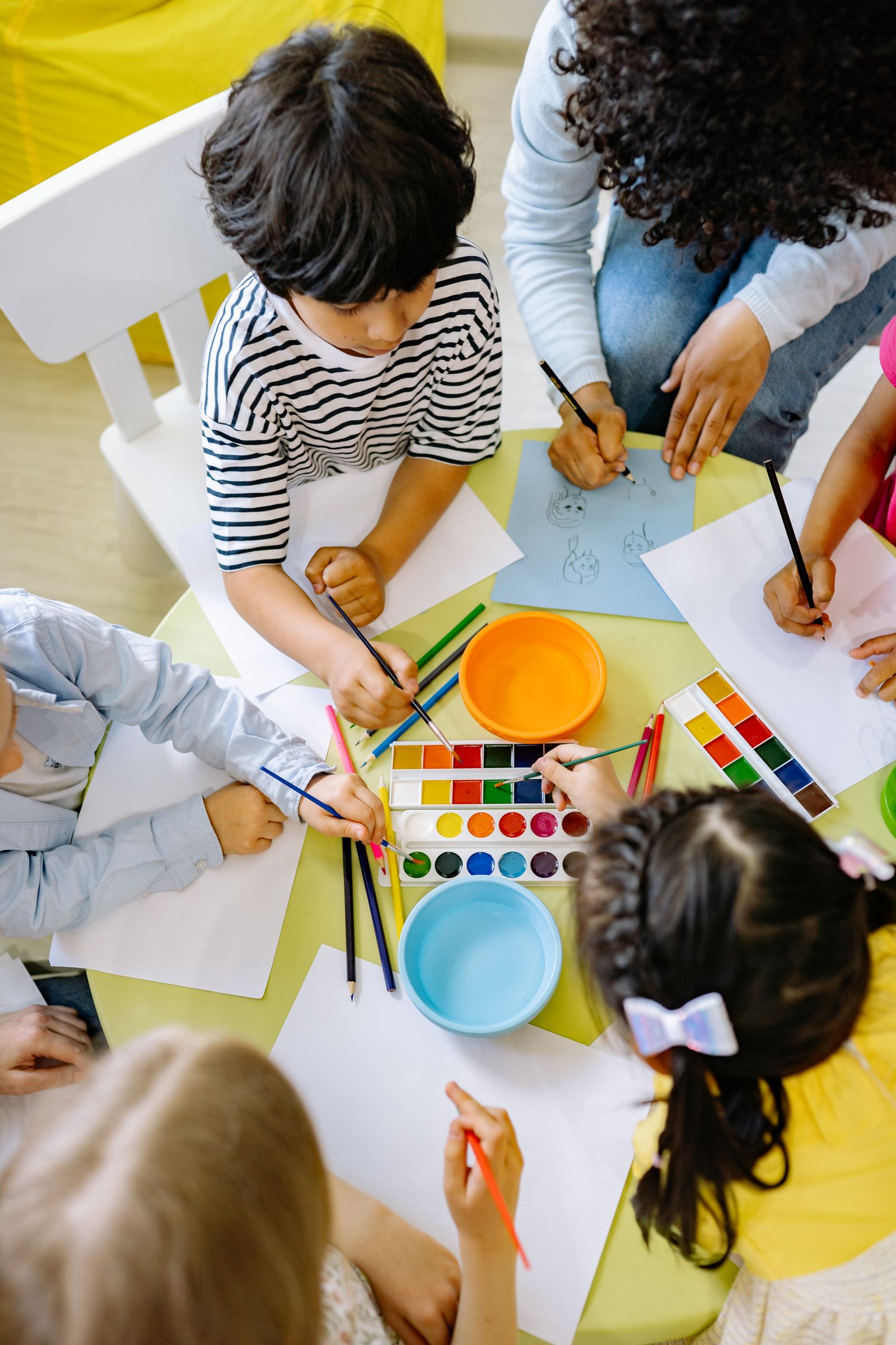 Children painting and learning at Little Steps